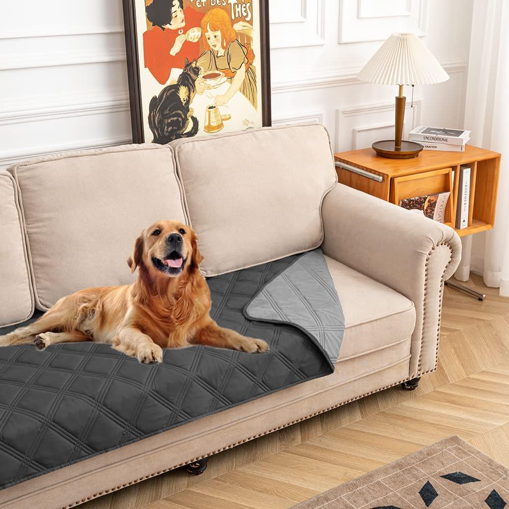 Fuguitex waterproof dog blanket front view featuring the quilted dark grey leakproof texture protecting an indoor couch.