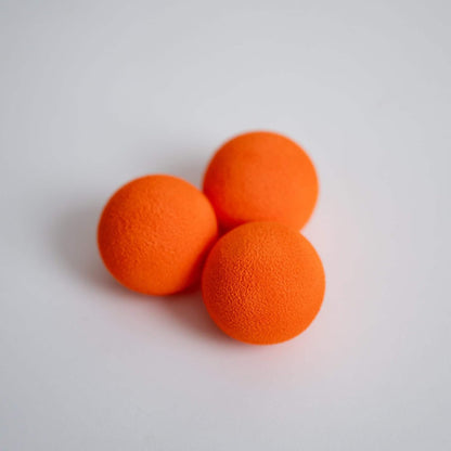 Kitten playing with Rawry orange foam ball toy