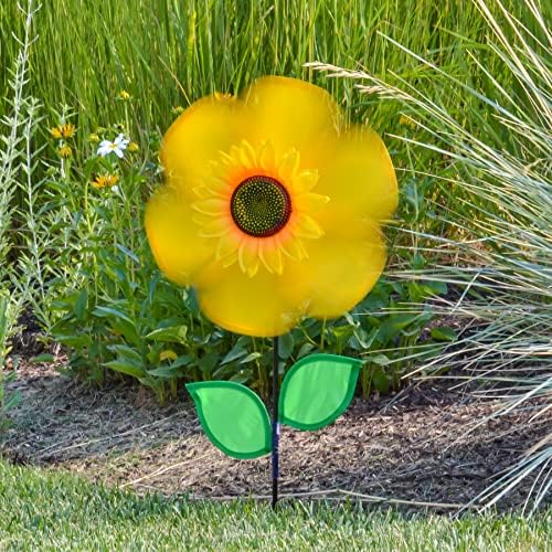 Sunflower garden decor spinner installed in a green lawn