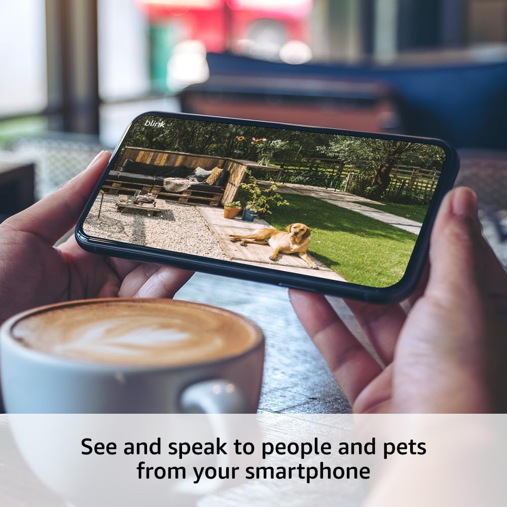 Blink Outdoor 4 smart security camera angled view emphasizing wide angle optical lens