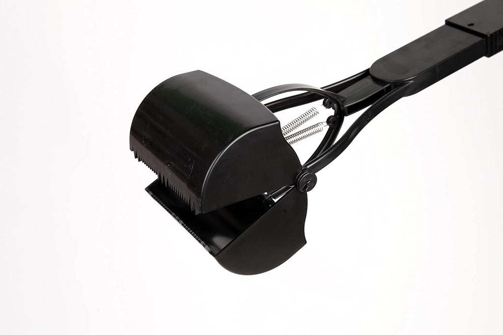 Ergonomic thirty two inch long handle dog scooper for back pain relief during cleanups.
