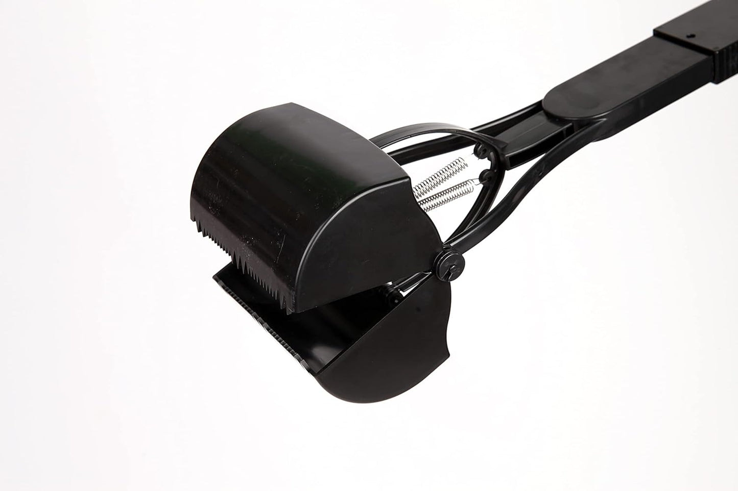 Ergonomic thirty two inch long handle dog scooper for back pain relief during cleanups.