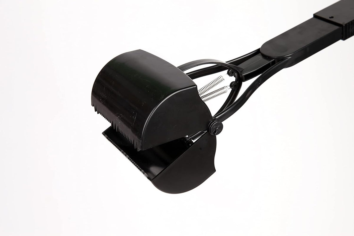 Ergonomic thirty two inch long handle dog scooper for back pain relief during cleanups.