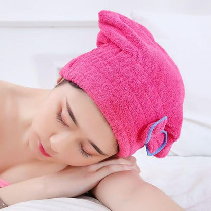 Adult model wearing the pink butterfly bow hair drying wrap after a shower.