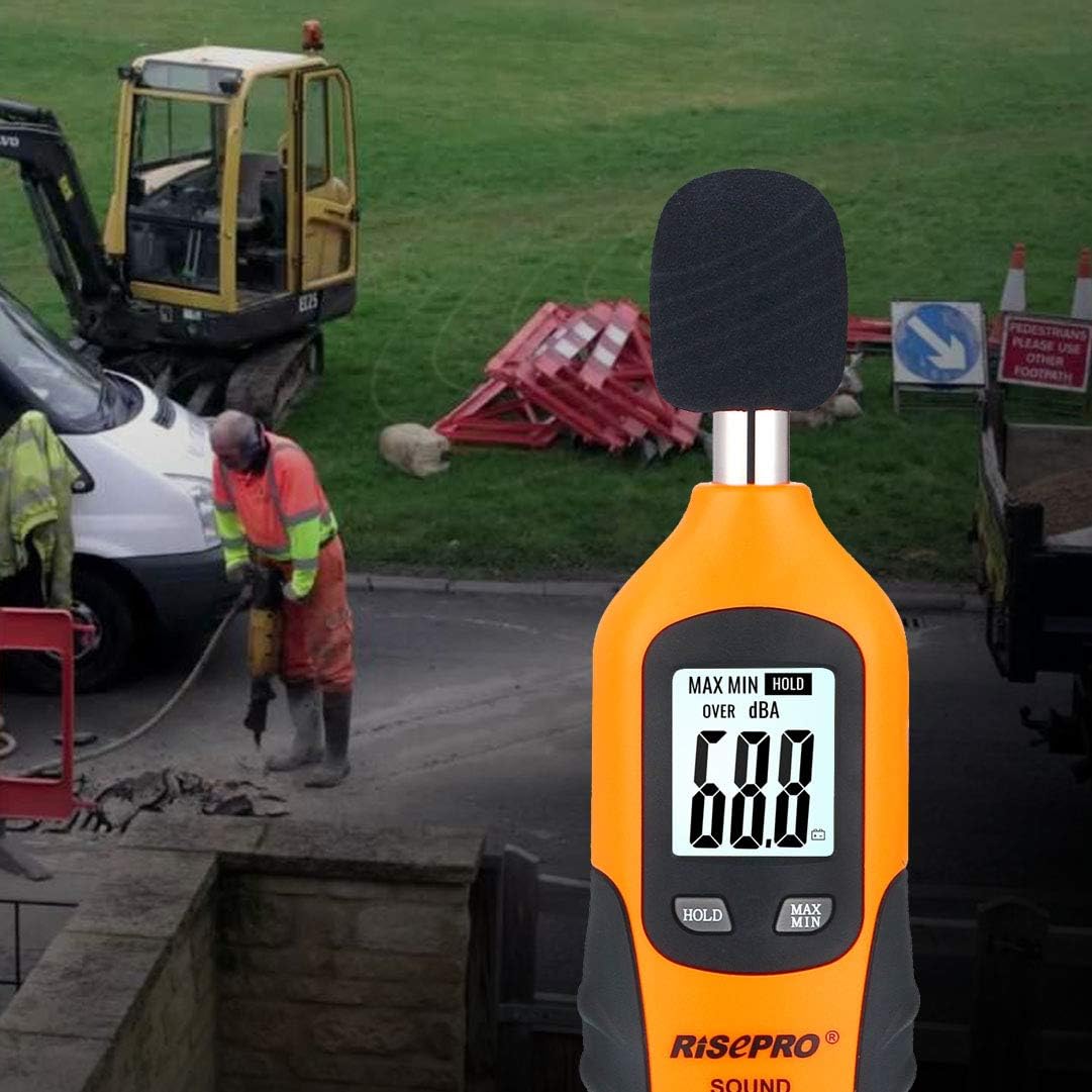 RISEPRO acoustic testing meter being held in hand to demonstrate its compact and portable design.