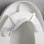 Doytn universal toilet seat pee deflector front view showing splash guard attachment