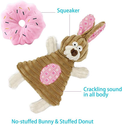 Small dog playing with Volacopets pink plush toy set