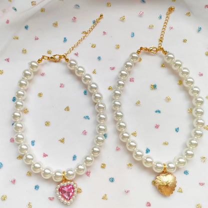 Side view of elegant pearl dog necklace for small pets