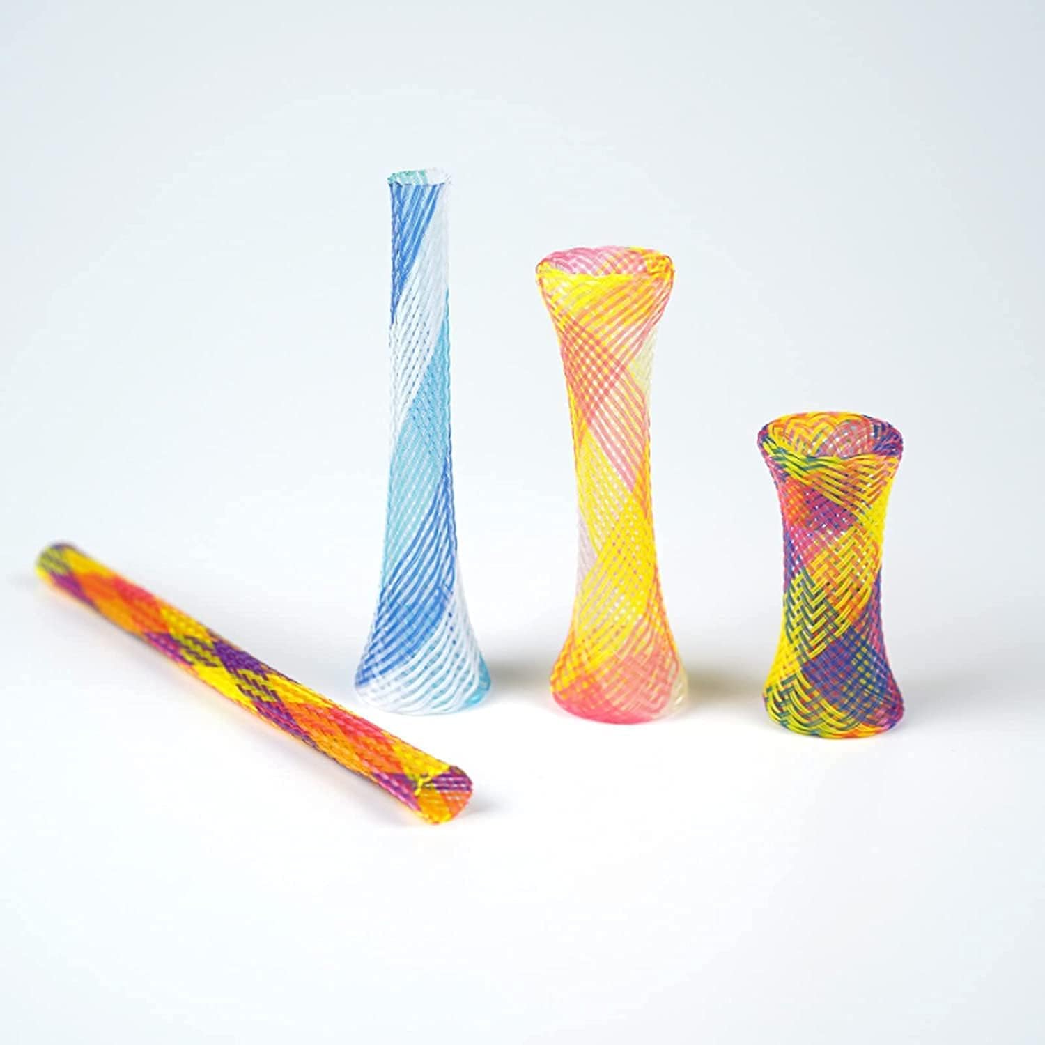 Assorted random colors of flexible plastic cat tube spring toys spread out on a floor