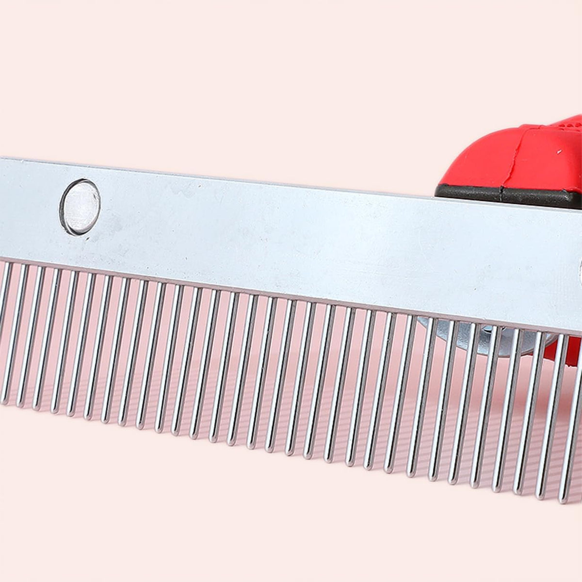 Close up of metal teeth on Octchoco dog grooming tool