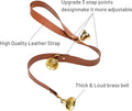 Close up of the three brass bells on leather strap