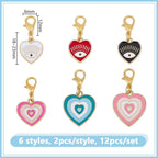 Close up of heart and round evil eye enamel charms