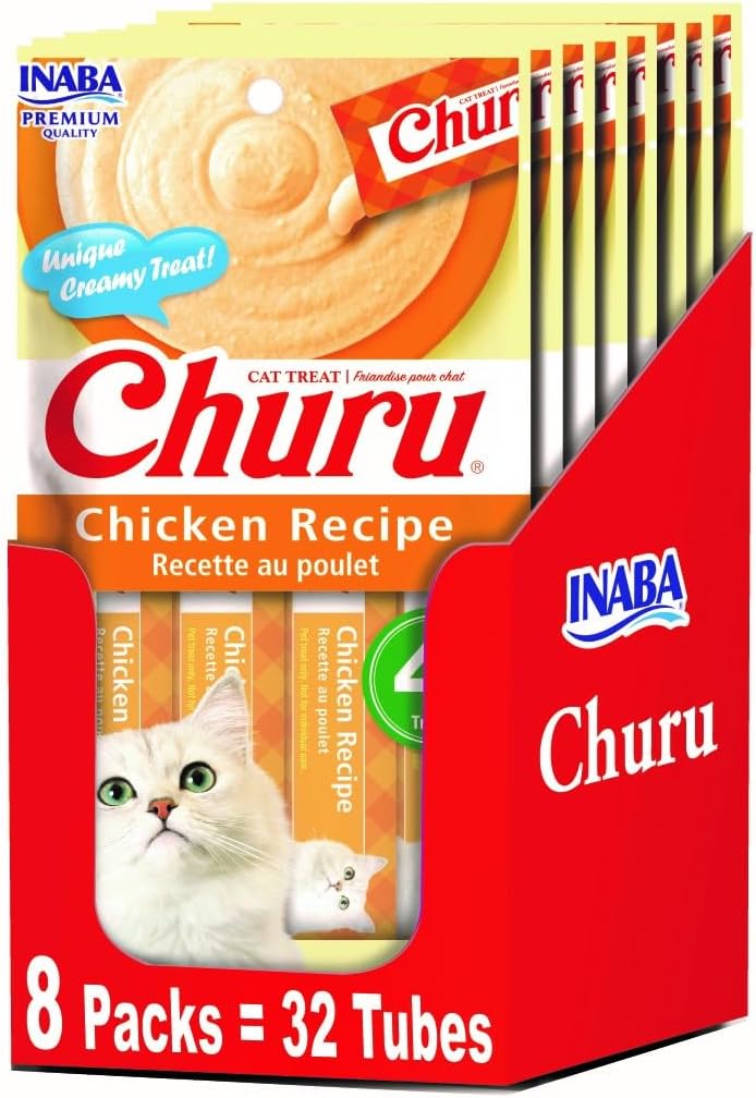Hand holding Inaba Churu tuna tube for feeding cat