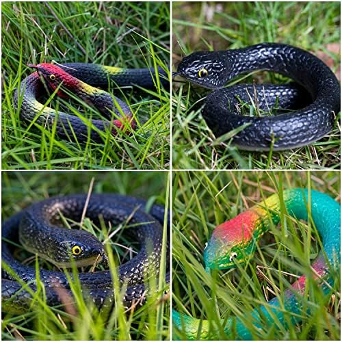 Four pieces of multi colored fake garden snakes displayed on green grass for bird deterrence
