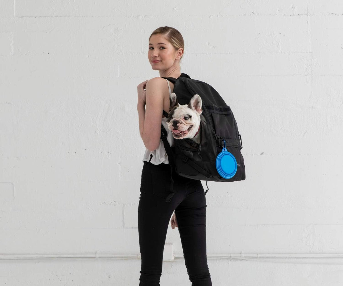 Timbuk2 heavy duty small dog backpack open compartment revealing the wipeable nylon interior liner
