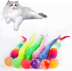 Cat batting a Le Tooter fuzzy worm toy across the floor