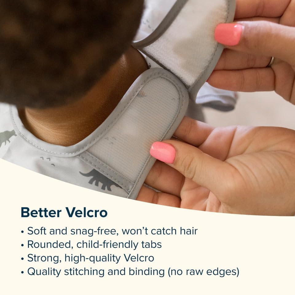 Detailed view of the elasticized wrist cuffs and water repellent fabric texture of the Tiny Twinkle bib.