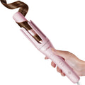 Tsuyagla automatic curling iron front view with pink finish