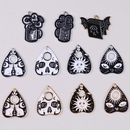 Assorted styles of Yeyulin enamel cat pendants for crafts