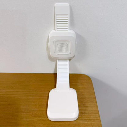 TIPNOT upgraded no drill adhesive furniture anchor front view showing the strong adhesive plates for baby proofing