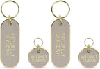 Lifestyle view of the teal Howligans keychain attached to a bag or keyring.