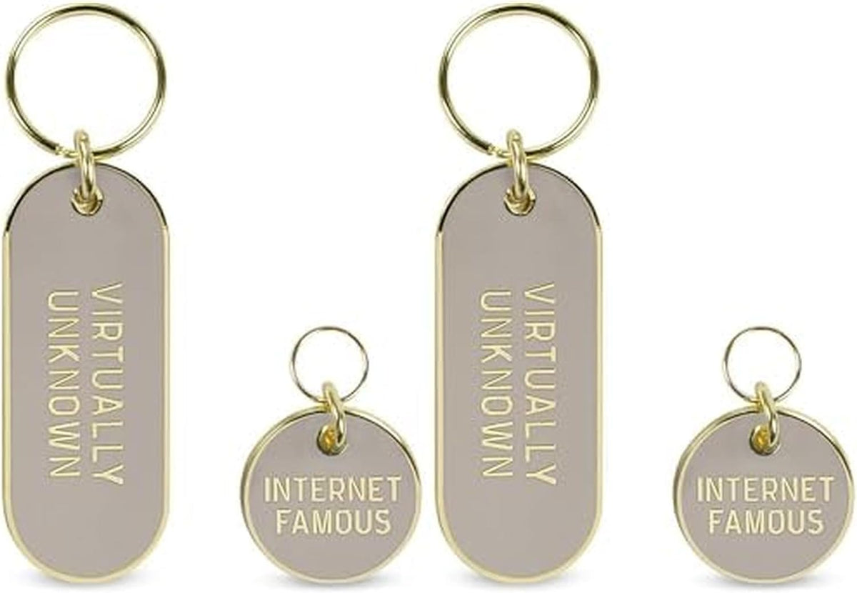 Lifestyle view of the teal Howligans keychain attached to a bag or keyring.