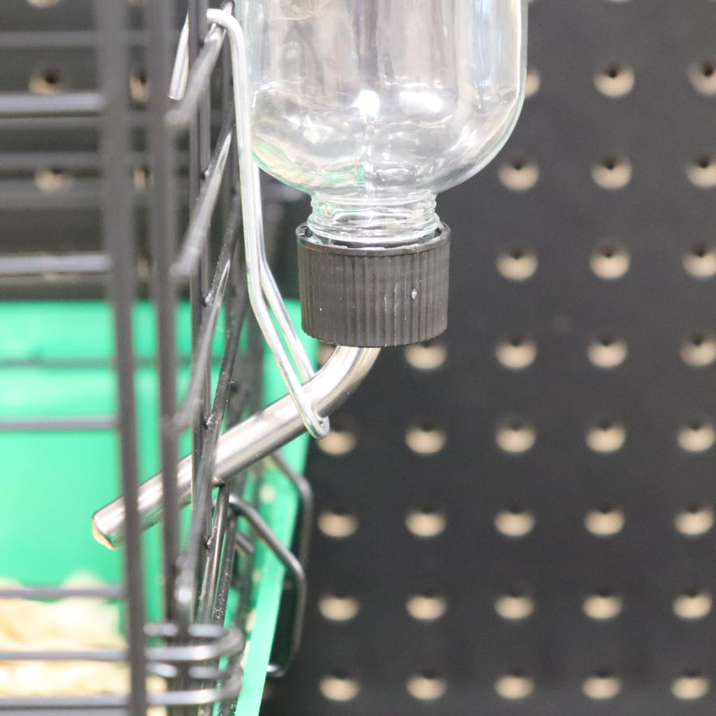 Lixit small animal hydration bottle mounted on wire cage