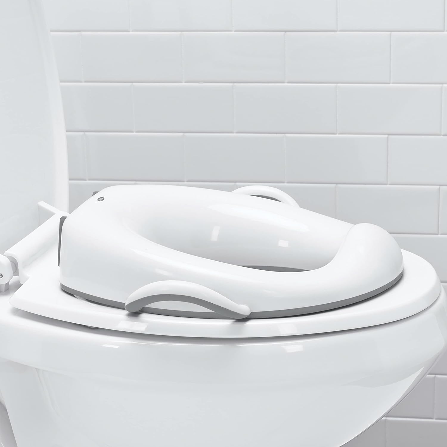 OXO Tot Sit Right Potty Seat Gray front view showing ergonomic high backrest and toddler handles