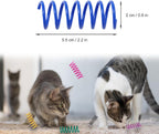 Twelve different colors of durable plastic spiral kitten toys scattered on a wooden floor.