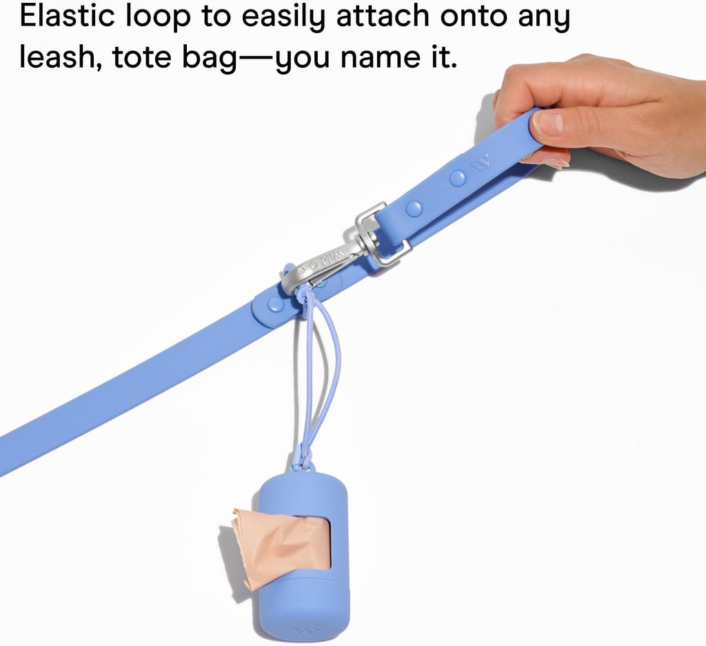 Soft touch lilac plastic dog poop carrier showing the elastic attachment loop.
