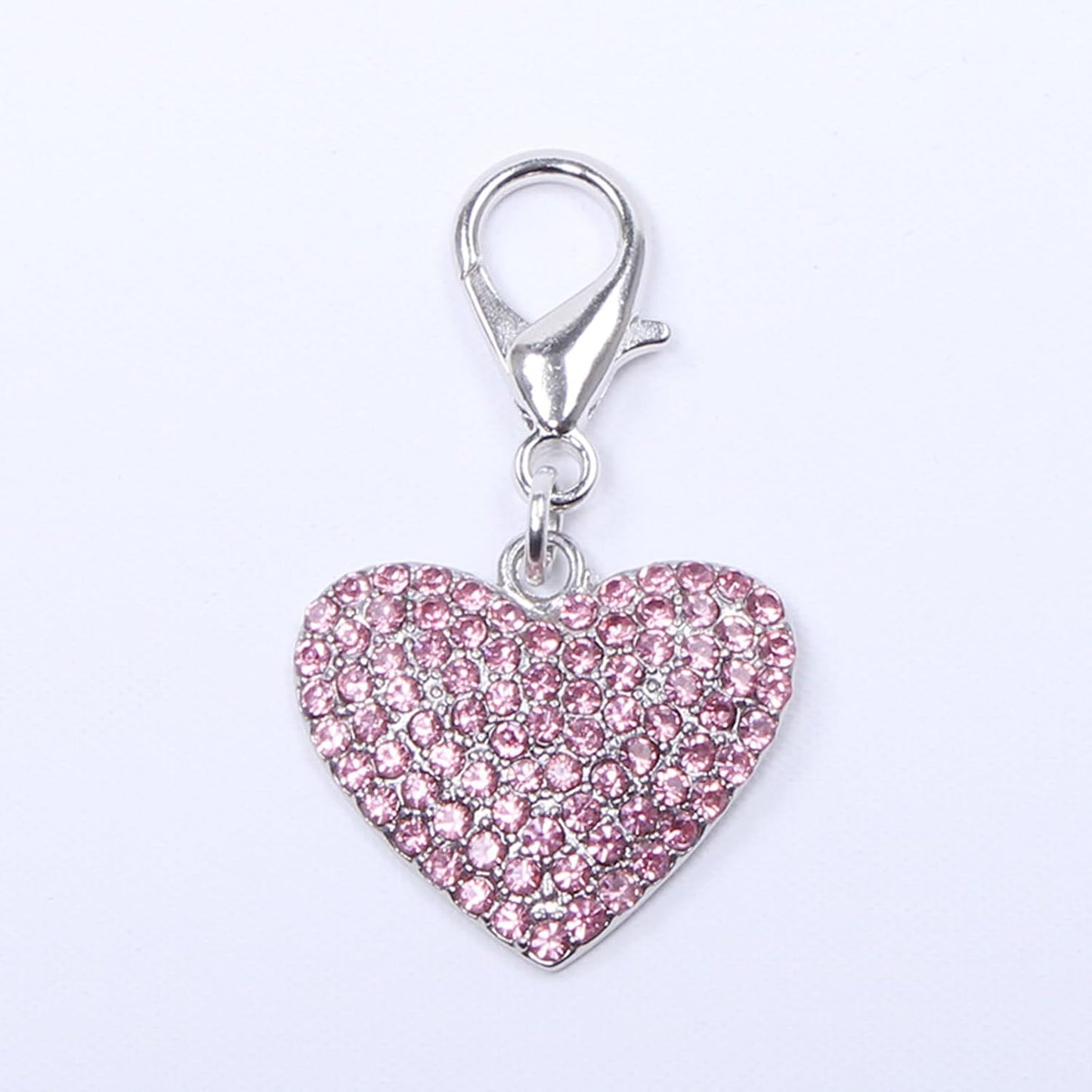 Close up of sparkling heart shaped rhinestone pet charm for small dogs