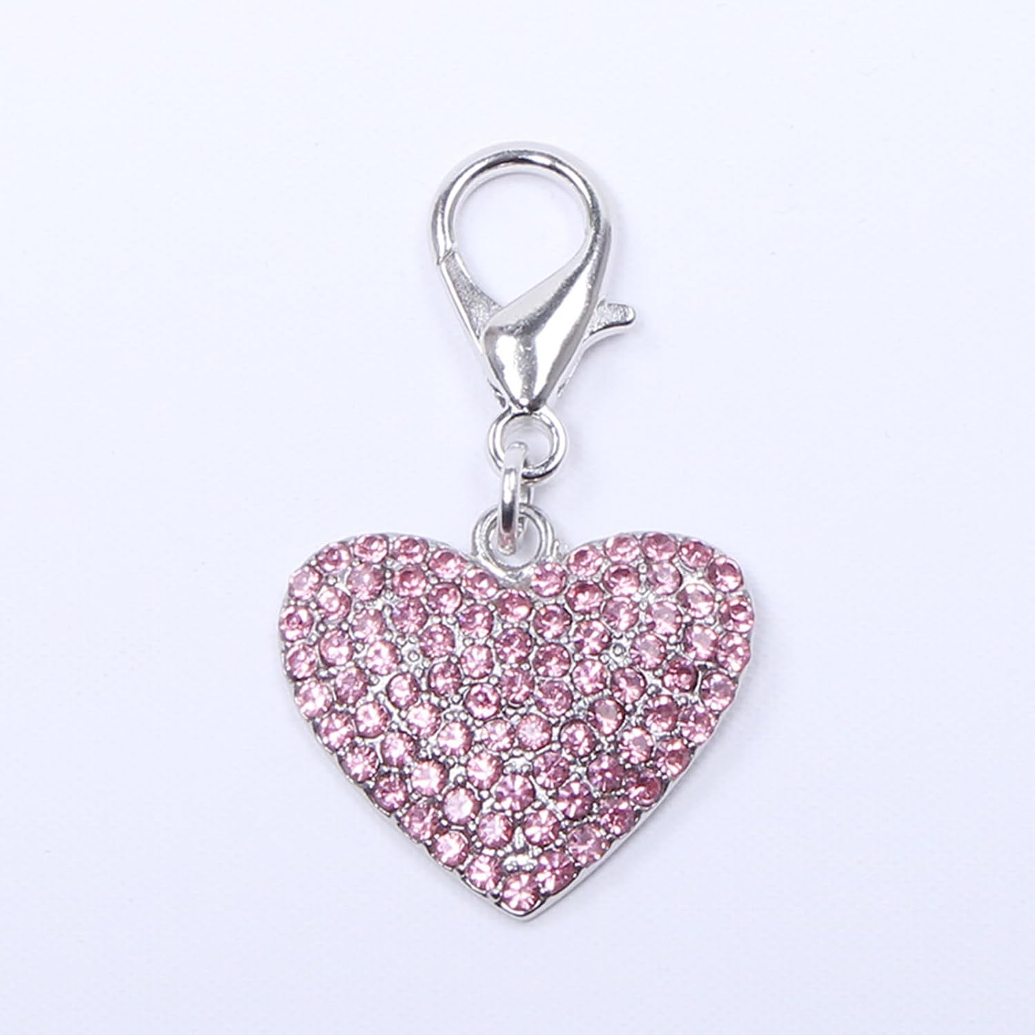 Close up of sparkling heart shaped rhinestone pet charm for small dogs