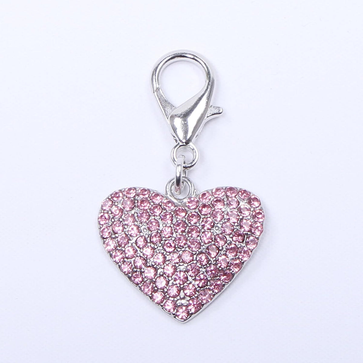 Close up of sparkling heart shaped rhinestone pet charm for small dogs