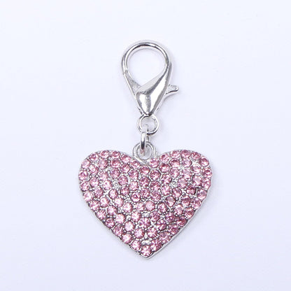 Close up of sparkling heart shaped rhinestone pet charm for small dogs