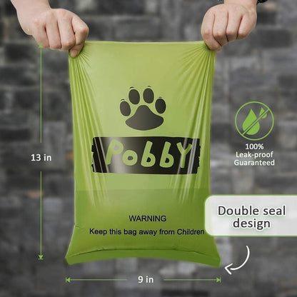 Green biodegradable pet waste bags with black paw prints on rolls.