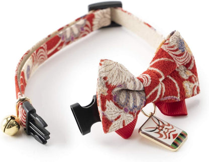 The Necoichi cat collar showing the included kabuki charm and bell