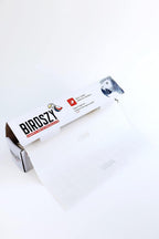 Birdszy bird cage paper liner laid out to show inch markings