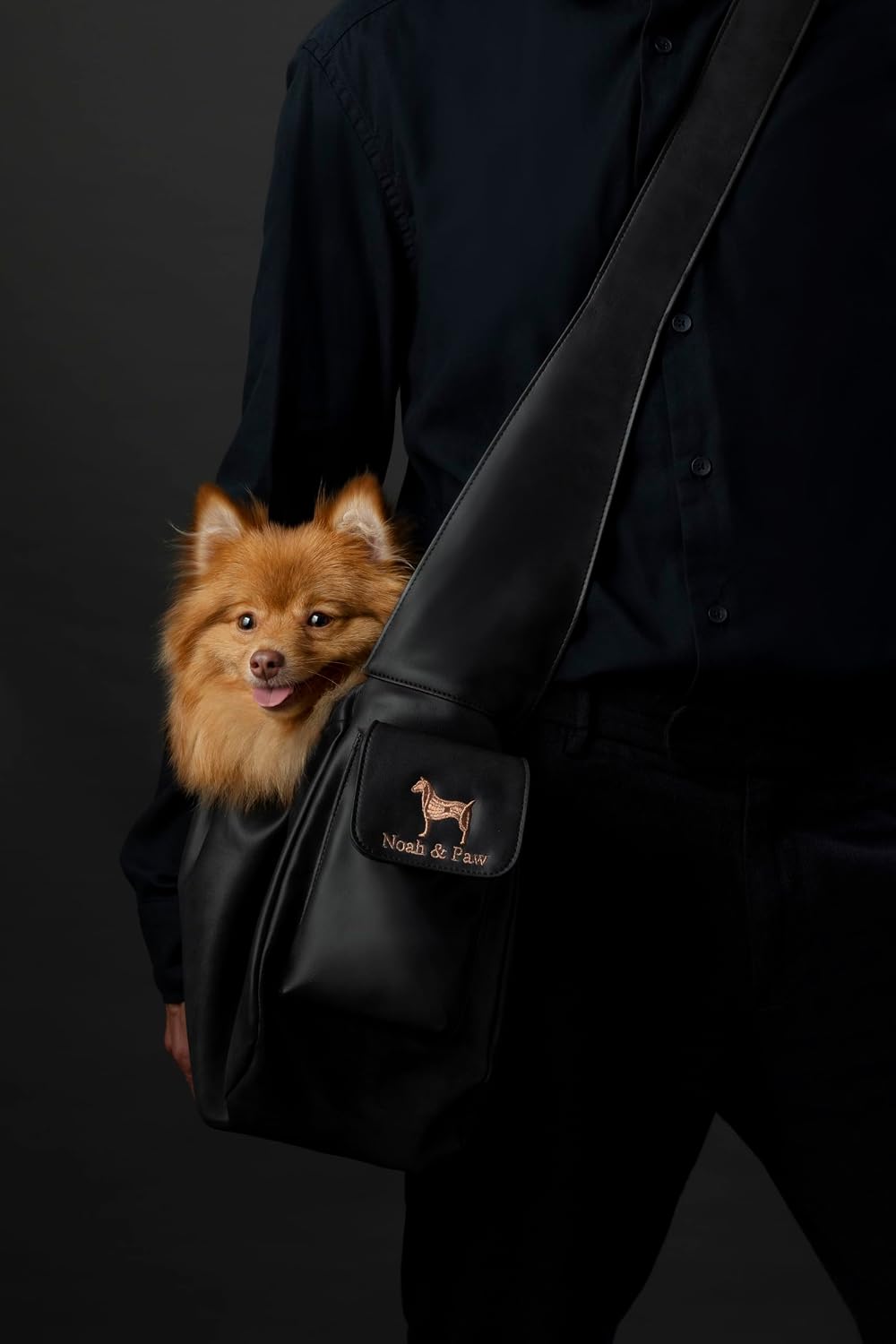 Small dog safely inside the Noah and Paw luxury pet sling