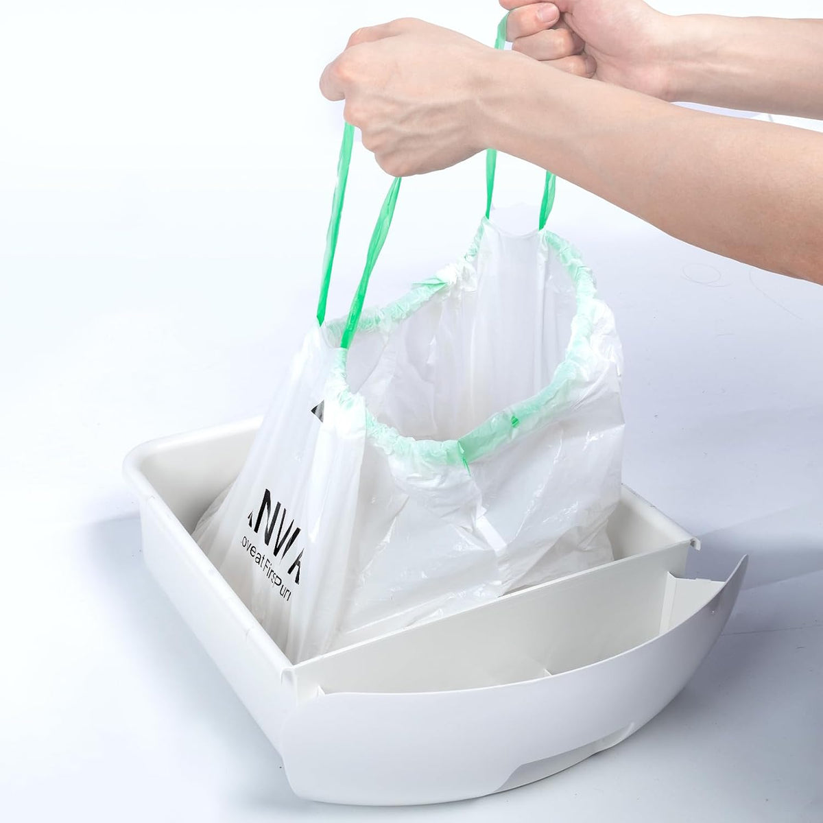 Removing sealed drawstring waste bag from pet litter box