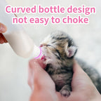 Top angle view of the five pink leak proof screw caps on the kitten nursing bottles.