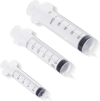 Three red rubber 8 French animal feeding tubes alongside blue bulb syringe