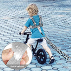 Child wearing Gloglow toddler backpack harness in a public park