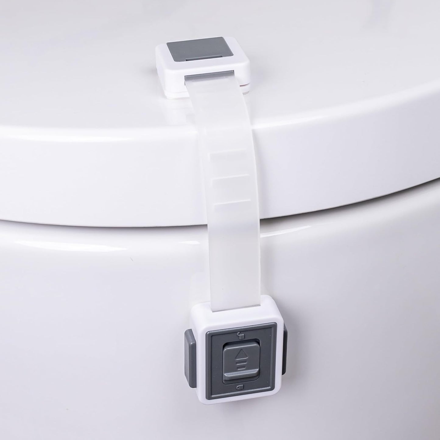 HomeBrella toilet locks baby proof two pack front view installed on a white toilet seat.