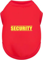 Dog wearing black security vest during outdoor play