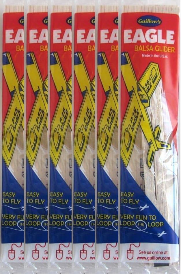 Guillow F-15 tactical fighter jet balsa wood flying toy airplane kit pieces.