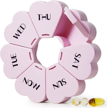 MOLN HYMY weekly pill organizer front view showing the heart shaped purple and pink design.