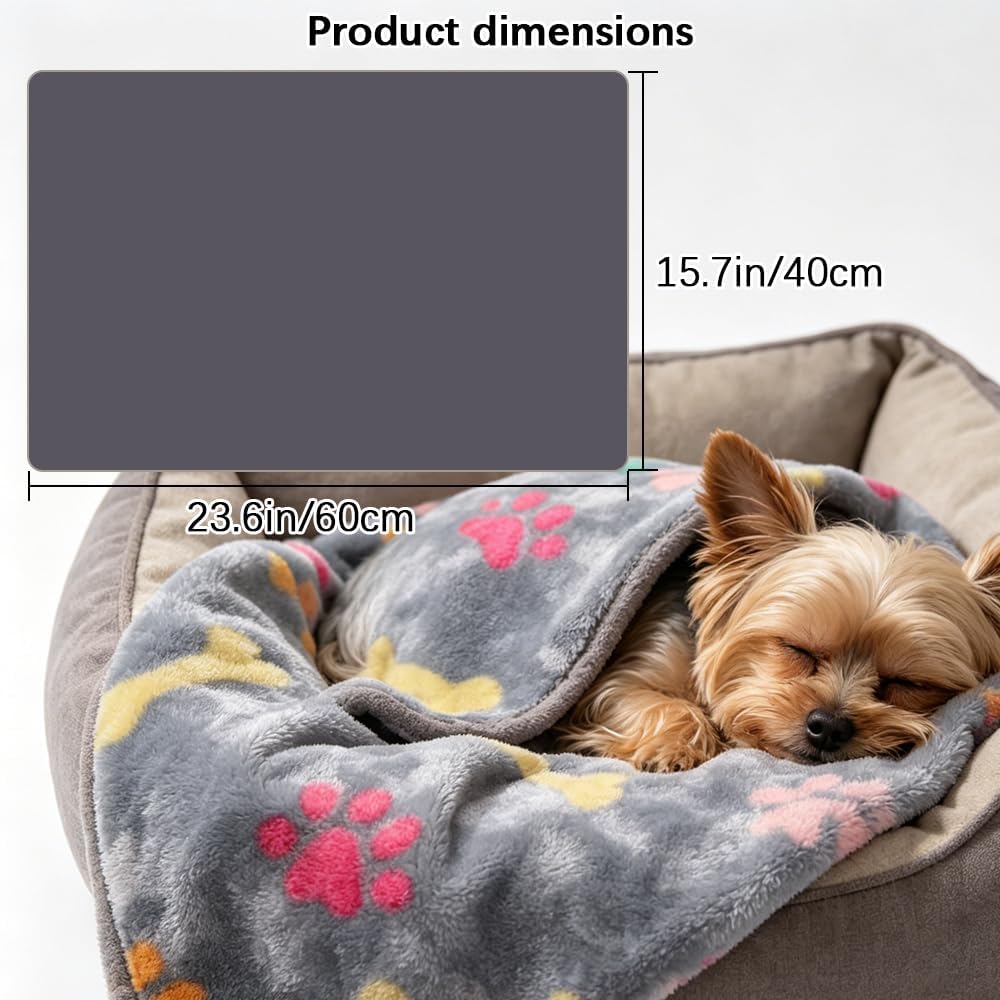 Soft flannel dog and cat throw blanket spread out on a sofa