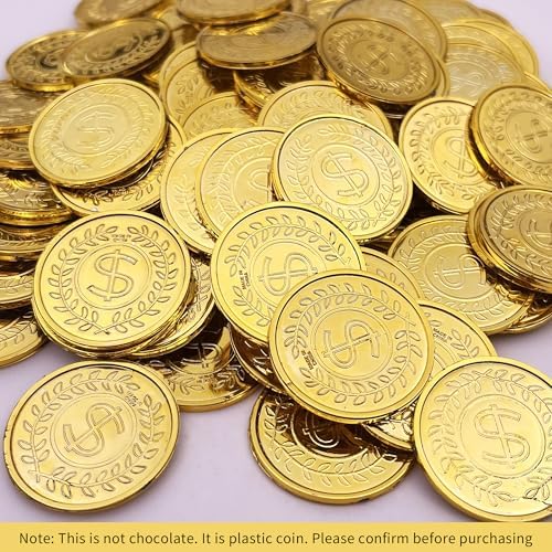 A pile of one hundred fake gold coins spread out for a children treasure hunt game.