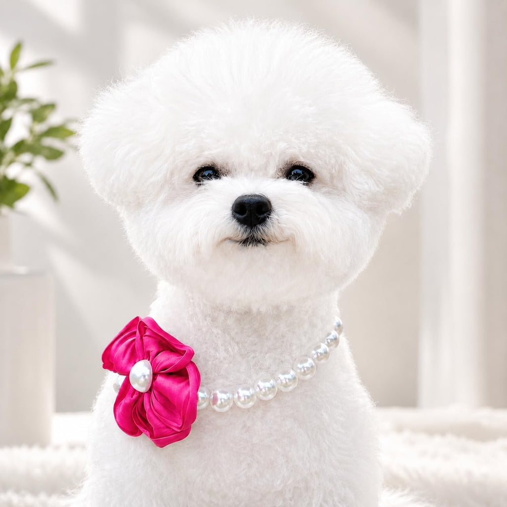 Adjustable faux pearl pet collar with a bright pink ribbon flower attachment