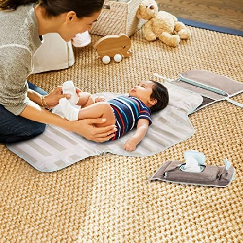 Side view of the lightweight grey Munchkin diaper changing mat highlighting the attachment strap for strollers.